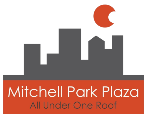 an orange and white sign on the side of a building