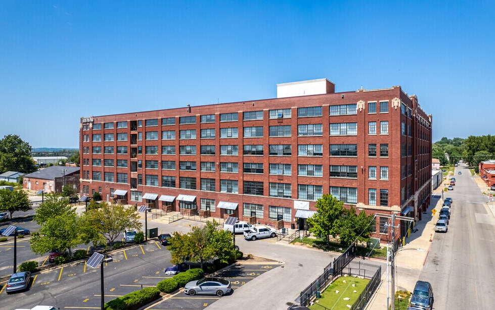 a large building with a lot of windows on the side of it