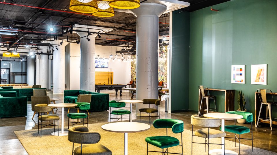 a large room with many tables and chairs